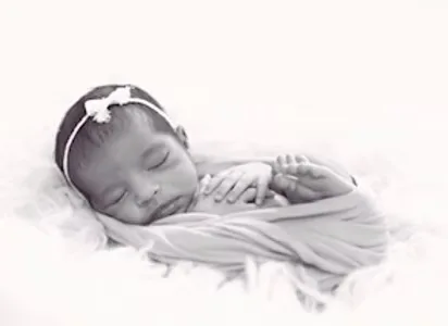 Newborn sleeping peacefully on a soft blanket